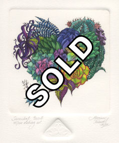 arrangement of succulents in the shape of a heart